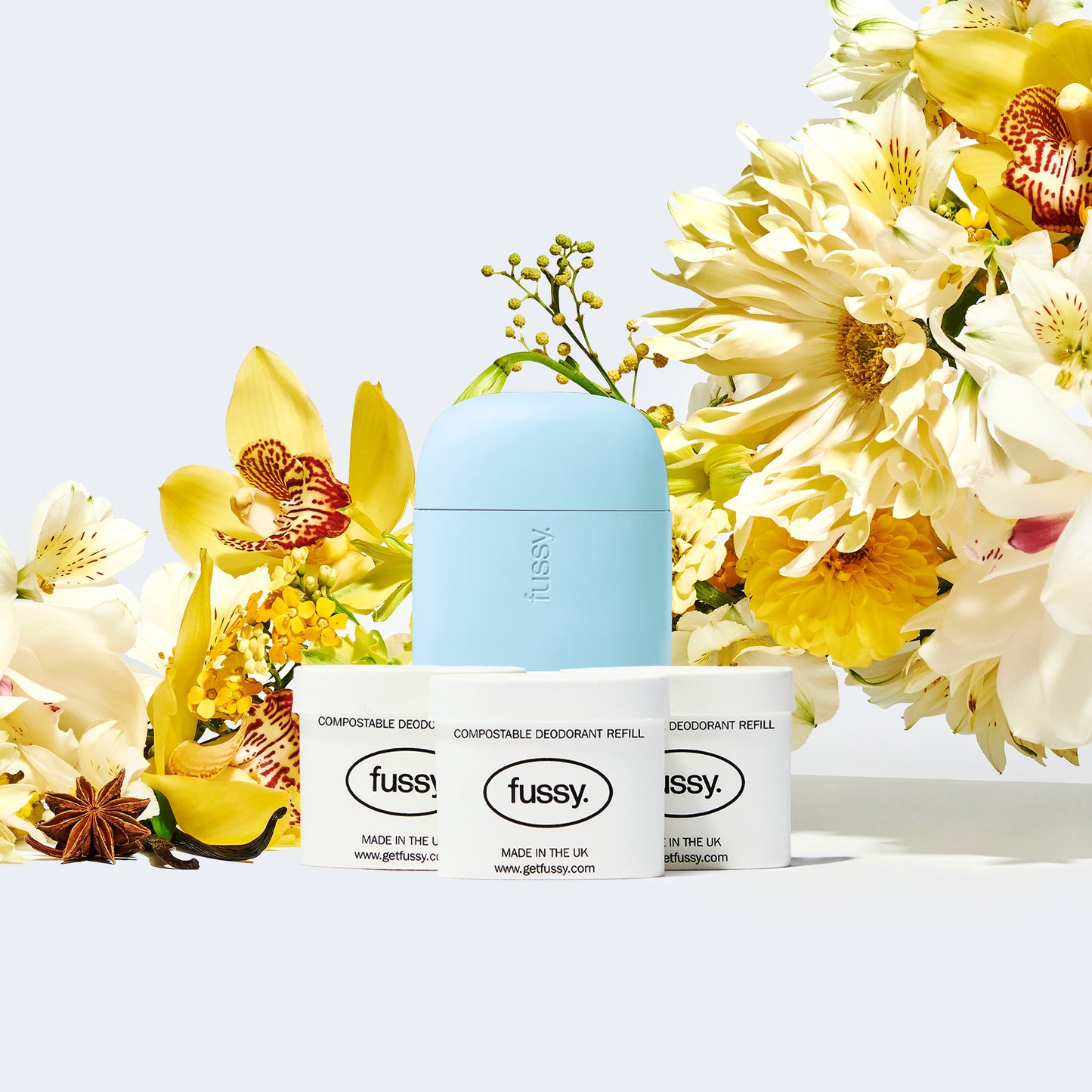 Fussy's natural, refillable deodorant refill pack in Sun Drunk scent (vanilla, ylang ylang, star anise) with deodorant case in Blue colour.