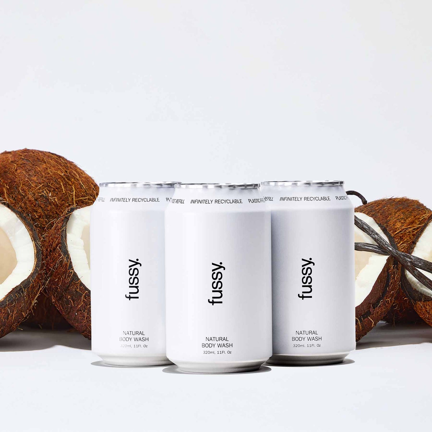 Fussy's Coconut Milk Refill Pack featuring three refills set against a backdrop of coconuts and vanilla pods