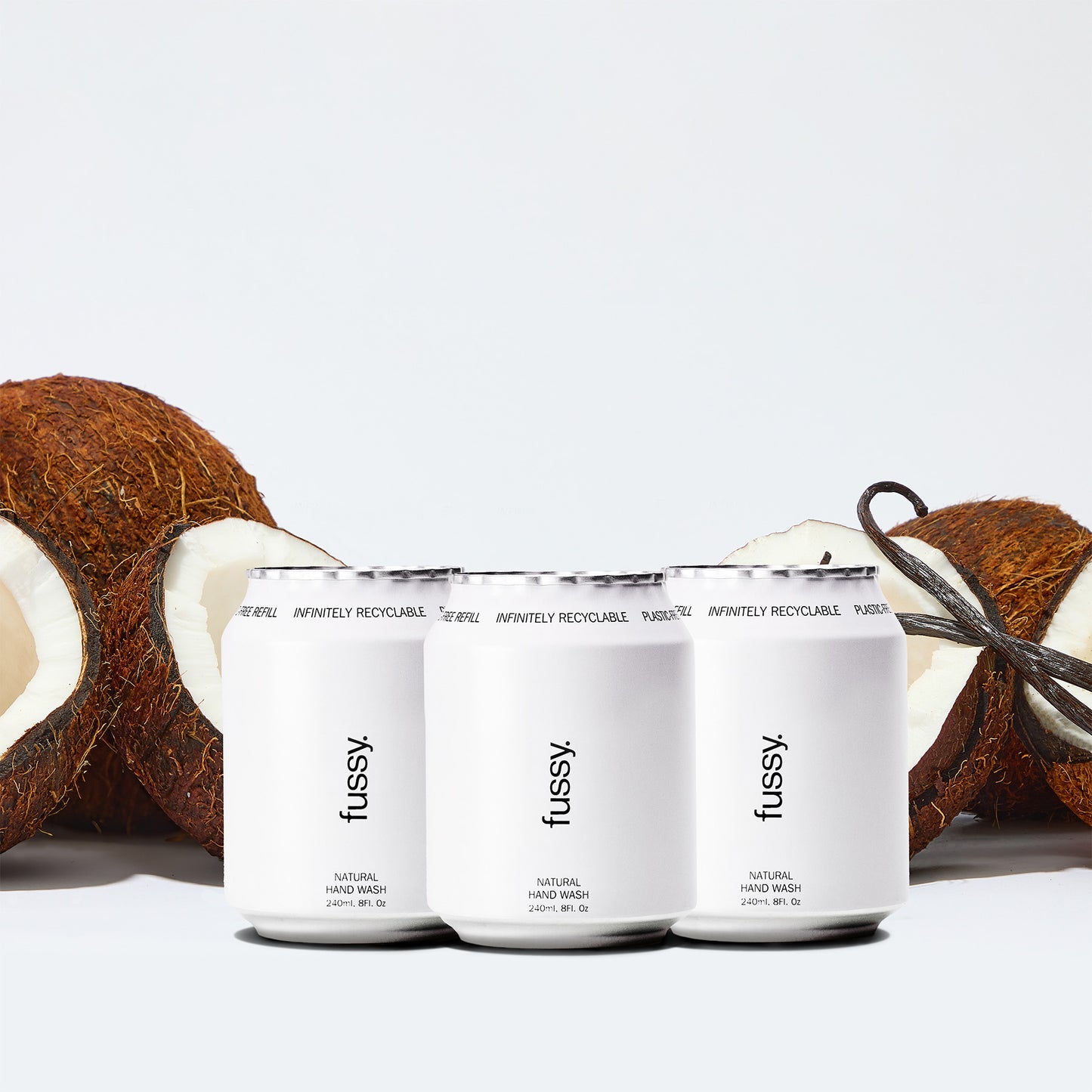 Fussy's Coconut Milk Refill Pack for hand wash featuring three refills set against a backdrop of coconuts and vanilla pods